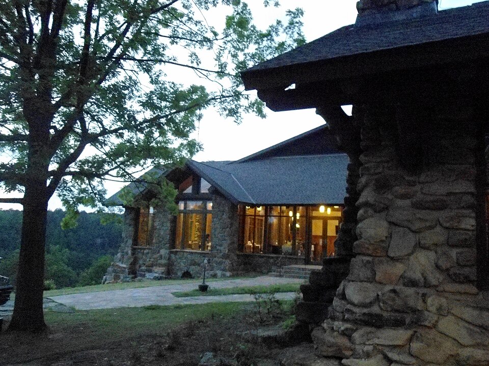 Mather Lodge at Petit Jean State Park, stone and timber exterior lit at Mather Lodge at Petit Jean State Park, stone and timber exterior lit at dusk