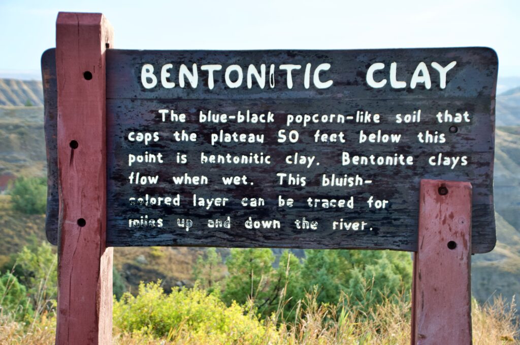 The Bentonitic Clay Overlook sign explaining the blue-black clay layers in Theodore Roosevelt National Park's North Unit