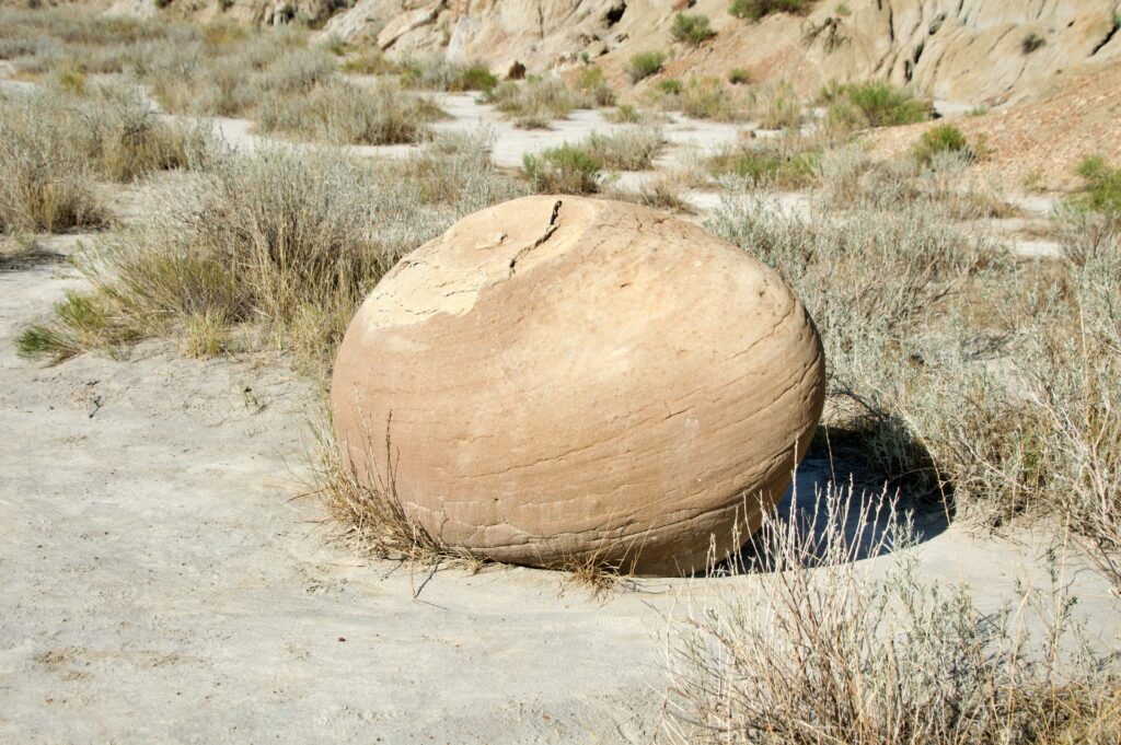 Cannonball Concretions — large spherical sandstone boulders with weathered holes in Theodore Roosevelt National Park's North Unit