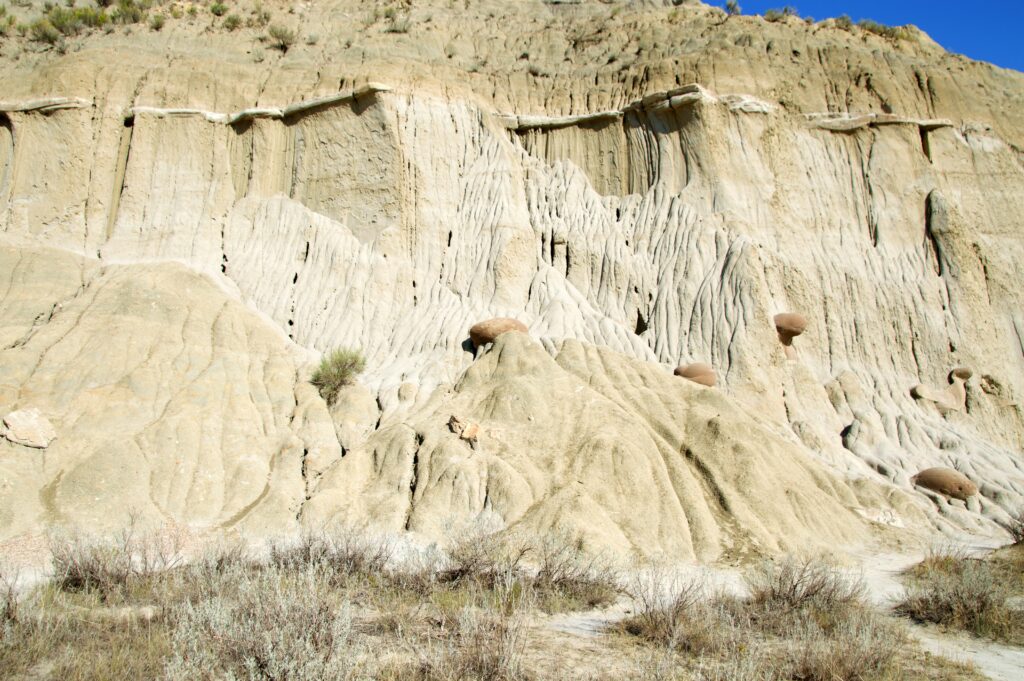 Cannonball Concretions perched atop eroded sandstone pedestals in Theodore Roosevelt National Park's North Unit