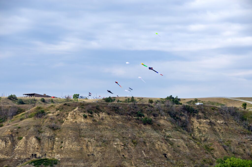 annual Medora Hot Air Balloon Rally & Badlands Kite Fest — kites soaring over the badlands just outside the park.