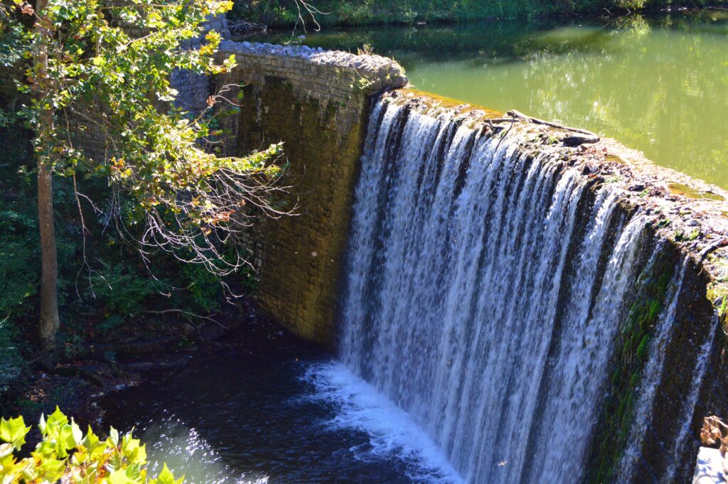 Two-tiered waterfall cascading over the CCC-built dam at Mirror Lake, Blanchard Springs Caverns, Arkansas