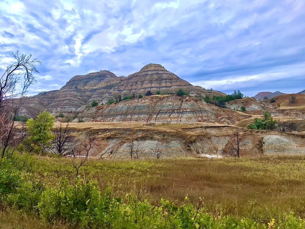 Layered badlands buttes along the Scenic Drive in Theodore Roosevelt National Park's North Unit