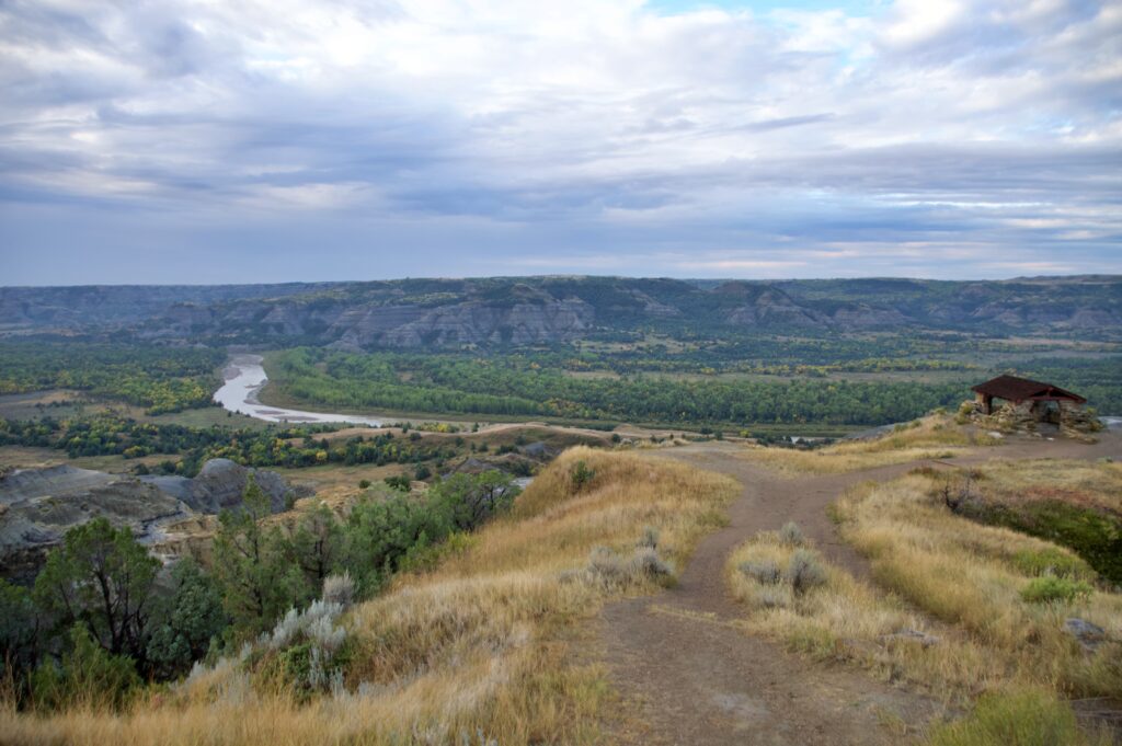 The CCC-built stone shelter at River Bend Overlook overlooking the Little Missouri River in Theodore Roosevelt National Park's North Unit