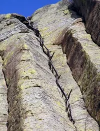 Historic 1893 wooden stake ladder built by William Rogers and Willard Ripley, still visible on the southeast face of Devils Tower