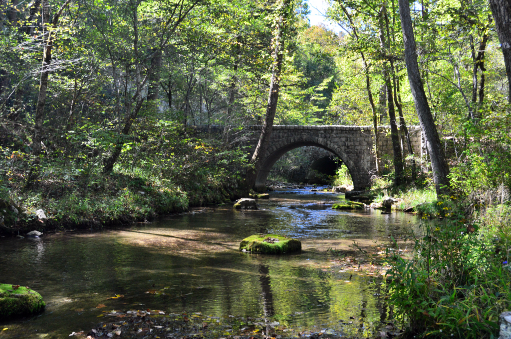 Stone arch bridge crossing the creek on the trail between Blanchard Spring and Mirror Lake
