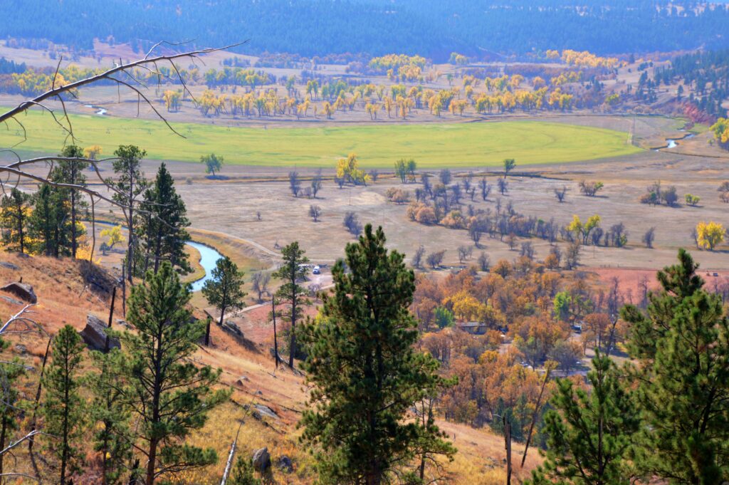 View of the Belle Fourche River winding through a golden valley from the Tower Trail at Devils Tower