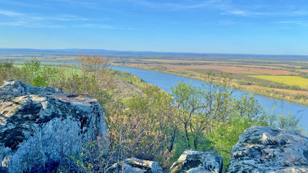 View from Petit Jean Lookout of the Arkansas River winding through farmland in the valley below